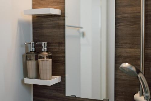 a bathroom with a glass door with a blender at Plage in Yamada