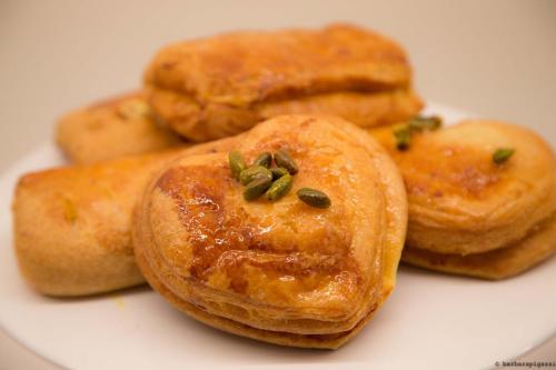 a group of pastries on a white plate at Point Hotel in Piove di Sacco