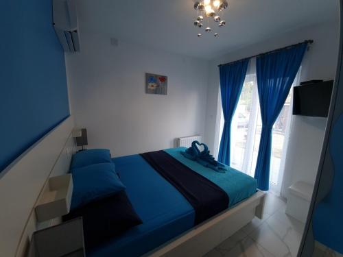 Posteľ alebo postele v izbe v ubytovaní TJ Apartment