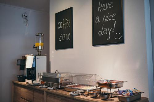 a counter with some food on top of it at Nest Guesthouse in Drobeta-Turnu Severin