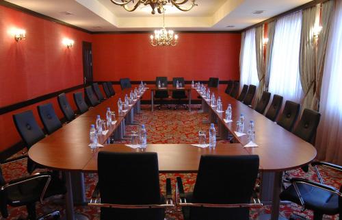a large conference room with a long table and chairs at Hotel Intourist Palace Batumi in Batumi