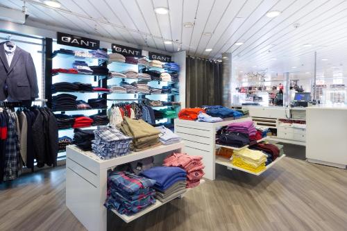 a store filled with lots of clothes on display at DFDS Ferry - MiniCruise Copenhagen to Oslo in Copenhagen