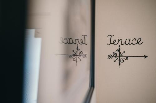 a refrigerator with two snowflakes on the side of it at Nest Guesthouse in Drobeta-Turnu Severin
