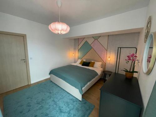 Ένα ή περισσότερα κρεβάτια σε δωμάτιο στο Hello Mountains Apartaments Sinaia