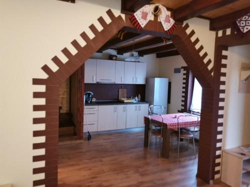 a kitchen with a large wooden stairway in a room at Cabana David in Beclean