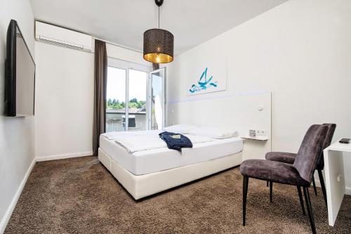 Hotel Velden - 24 Checkin Zimmer im Zentrum