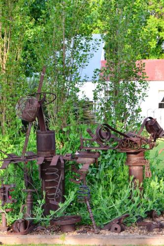 a statue of a garden with weeds and plants at The Gables Guest House in Belfast