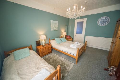 Katil atau katil-katil dalam bilik di Compton Guest House