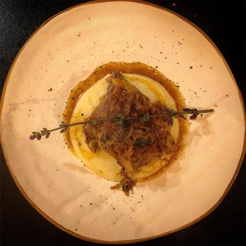 a white plate with a piece of food on it at Podere Bellavista in San Gimignano