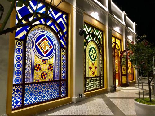 a group of stained glass doors on a building at Cat Cat Galerie d’Art in Sa Pa