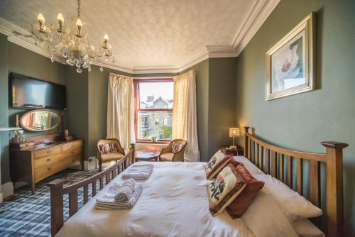 Katil atau katil-katil dalam bilik di Compton Guest House