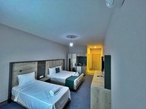 Postel nebo postele na pokoji v ubytování Beypark Hotel