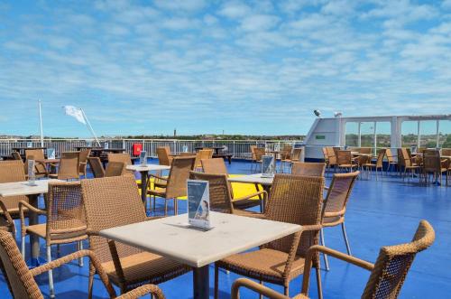 a patio with tables and chairs on a roof at DFDS Ferry - Newcastle to Amsterdam in Newcastle upon Tyne