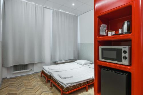 A bed or beds in a room at Omena Hotel Tampere