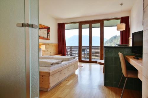 Postel nebo postele na pokoji v ubytování Hotel Pension Geiger