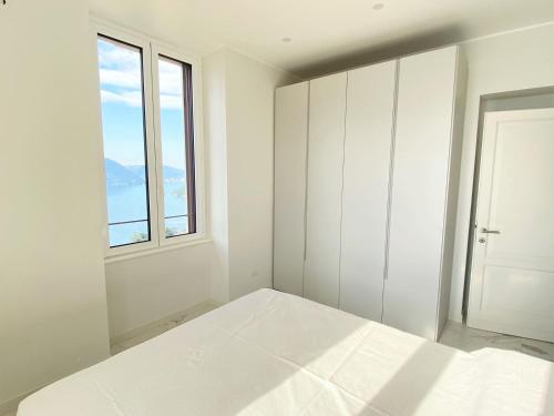 Postel nebo postele na pokoji v ubytování Villa Nova apartment in Moltrasio – Lake Como