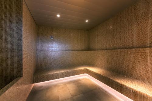 a bath tub with a light in a room at Tokyo Bay Shiomi Prince Hotel in Tokyo
