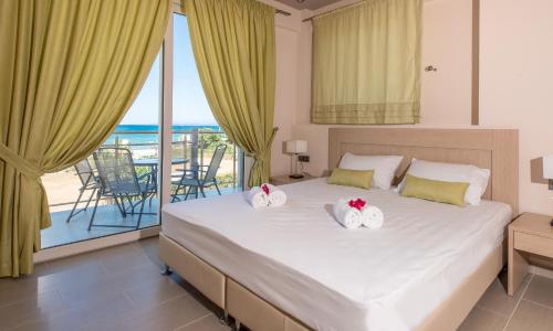 A bed or beds in a room at Zoi Apartments