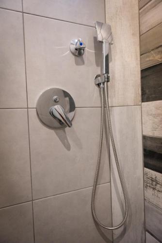 a shower with a faucet in a bathroom at Haus Viktoria 1 in Limenas