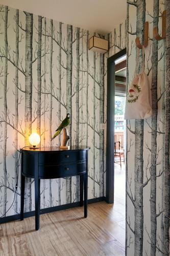 a bird sitting on top of a piano in a room at Maison d'hôtes Ermitage in Chateau-d'Oex
