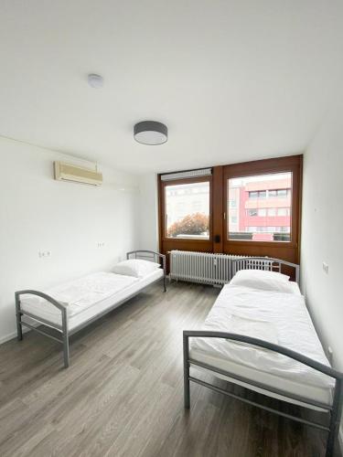 Säng eller sängar i ett rum på PF Unterkunft