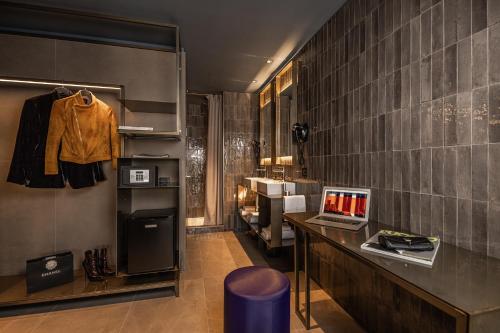 a room with a desk with a laptop on it at HD8 Hotel Milano in Milan