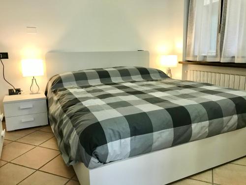 Posteľ alebo postele v izbe v ubytovaní Il Ciottolo Apartments