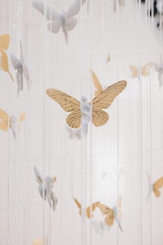 a bunch of birds are flying in the air at MYR Palacio Vallier in Valencia
