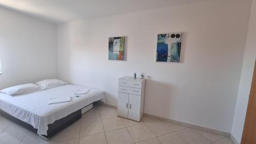 Postel nebo postele na pokoji v ubytování Apartments Margita