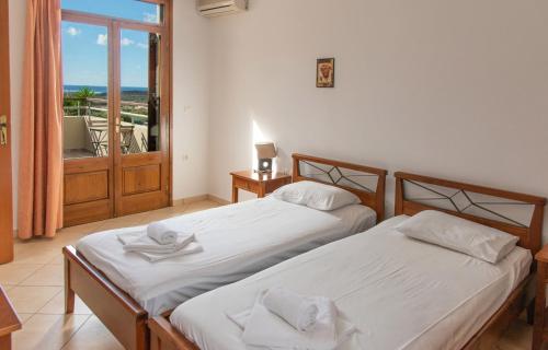 Postel nebo postele na pokoji v ubytování Nireides villas 'TOP DESTINATION'