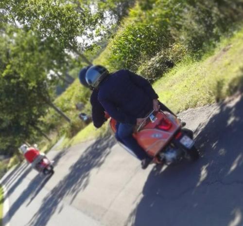 a person riding a motorcycle down a street at Huis van Silvie in Koolskamp