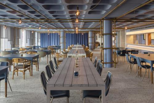 a large dining room with tables and chairs at NEXT - by Savoy Signature in Funchal
