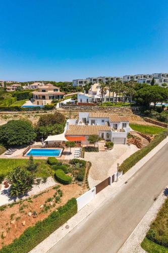 an aerial view of a house with a swimming pool at Beach Villa - oceanfront villa Martinhal in Sagres