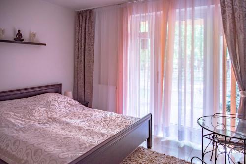 Ένα ή περισσότερα κρεβάτια σε δωμάτιο στο Apartamenty Kornel