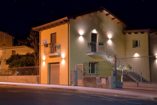 a house with lights on the side of a street at Civico 33 in Scalea