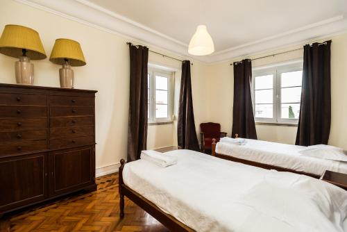 Posteľ alebo postele v izbe v ubytovaní Apartamentos Lux Dinastia