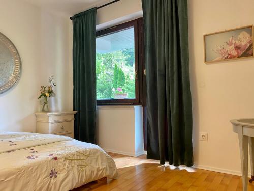 Ένα ή περισσότερα κρεβάτια σε δωμάτιο στο Garden Apartments Bled