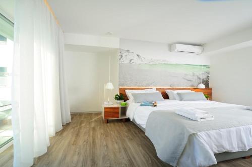 Ένα ή περισσότερα κρεβάτια σε δωμάτιο στο Atrium Ambiance Hotel
