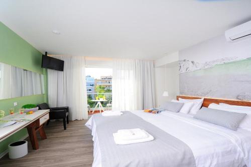 Ένα ή περισσότερα κρεβάτια σε δωμάτιο στο Atrium Ambiance Hotel