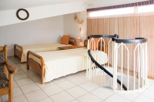 Postel nebo postele na pokoji v ubytování Sea Side Villa