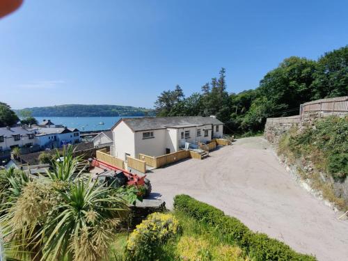 a house on the side of a dirt road at Crow's Nest Glandore - 1 - Self Catering in Glandore