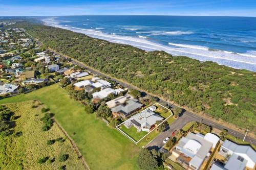 an aerial view of a house and the ocean at SALTWATER HOUSE - Opposite the beach and views over the lake! in Ocean Grove