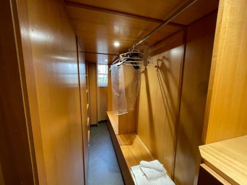 a bathroom with a walk in shower and a closet at Appartamento Cavour in centro in Palermo