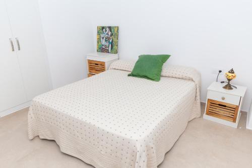 A bed or beds in a room at Cap de Mar CULLERA