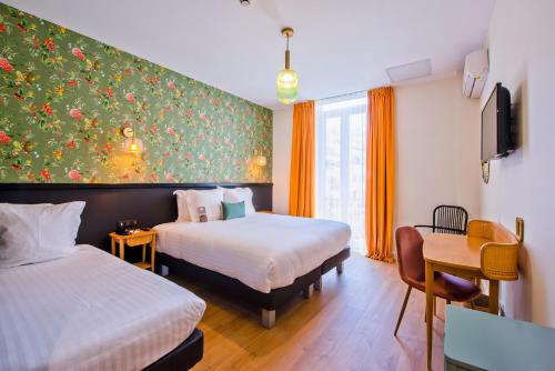 Voodi või voodid majutusasutuse Hotel La Villa Nice Promenade toas