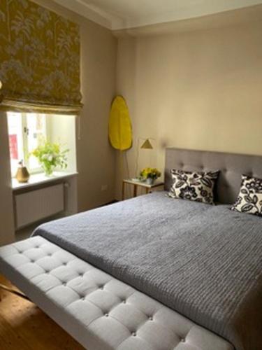 a bedroom with a large bed and a window at Gutsverwaltung Schloss Eyrichshof in Ebern