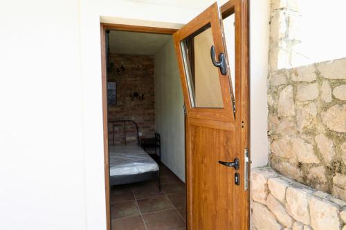 an open door to a room with a bed at Mountains Villa near Budva in Budva