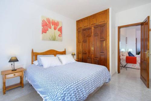 a bedroom with a bed and a dresser and a chair at Casa Gasparini in Tahiche