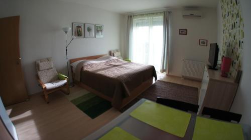 Postel nebo postele na pokoji v ubytování Club 218 Prémium Wellness Apartman