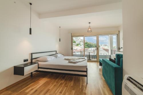 Postel nebo postele na pokoji v ubytování Poseidon Apartments